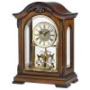 Bulova Durant Walnut Chiming Clock with elegant old-world walnut finish, featuring a rotating pendulum, screened glass panels, and Westminster melody chime – perfect for a classic decor setting.