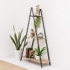 Modern A-frame bookcase with three-tiered wood-look shelves and sturdy black metal frame. 