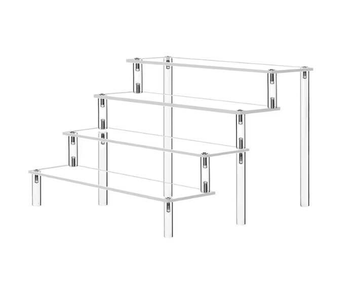 Clear multi-tier acrylic display stand showcasing cupcakes, perfumes, and figurines, ideal for home or store use.